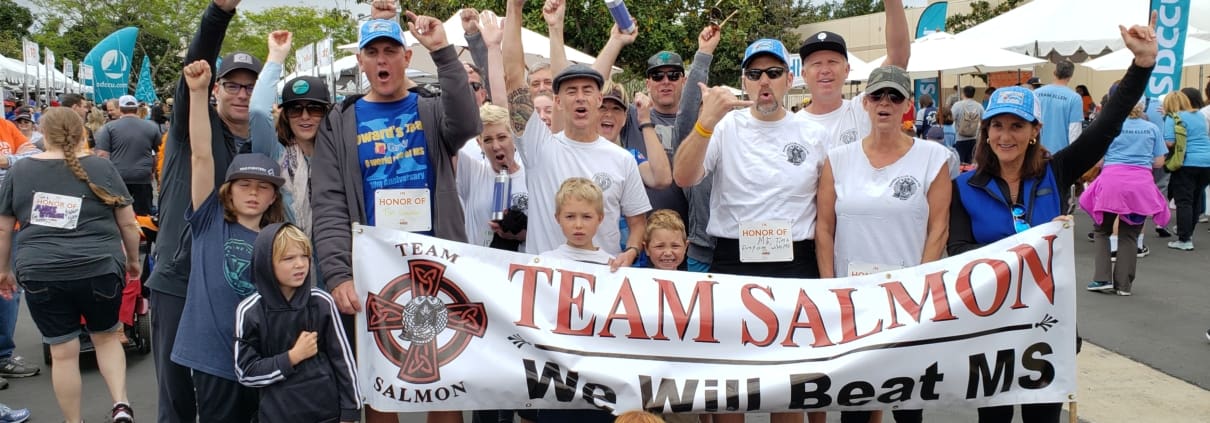 A group of people holding up a banner